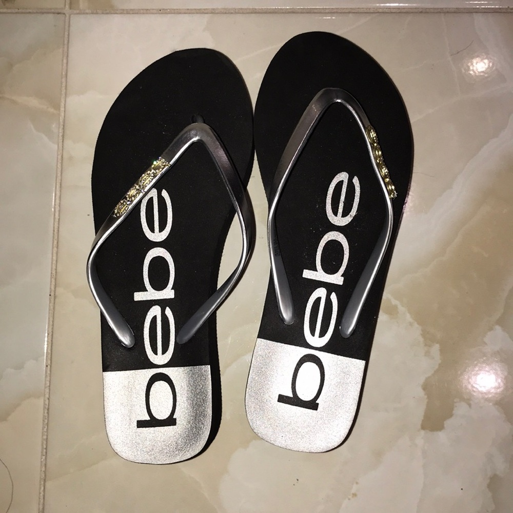 Bebe Flip Flops in Black and Silver with Gold Logo